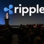 Volle conferentiezaal in New York met een groot Ripple-logo op het podium tijdens Swell
